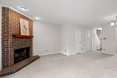 Unfurnished living room with carpet flooring, a br