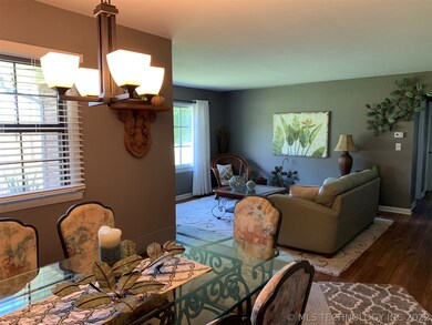 View from kitchen of dining room and front living
