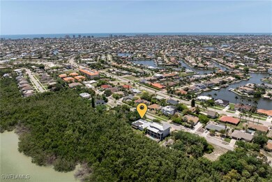 Aerial perspective of suburban area with a large body of water
