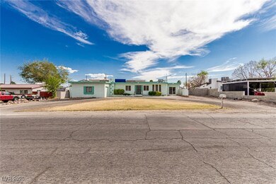 Single story home featuring a front lawn