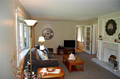 ANOTHER VIEW OF THE LIVING ROOM WITH GAS FIREPLACE
