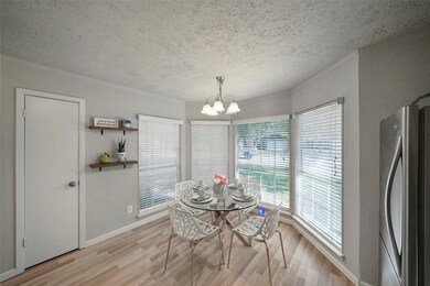 Enjoy morning coffee in this charming breakfast area surrounded by bay windows with picture-perfect views of the front yard. What a wonderful way to start your day.
