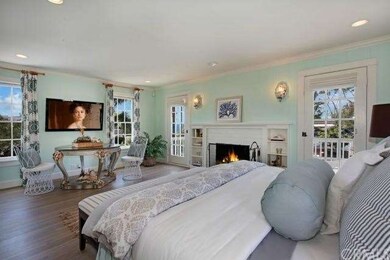 Your master bedroom draws in ocean views, a wood b