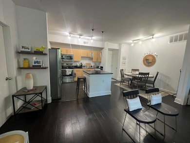Kitchen featuring stainless steel appliances, dark