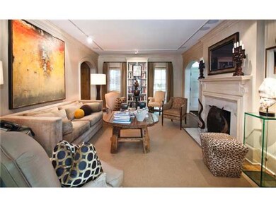 Looking from the Sunporch towards the front of the house, you can just spot the Front door to the right. The windows in this room and the Living Room are to the floor.  You also get a glimpse of the wonderful arches that form an allee' along the fron