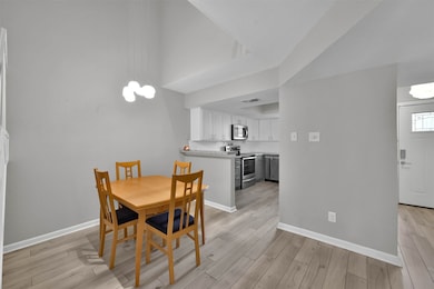 View of dining room into kitchen which faces the f