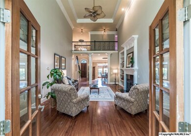 Another view into the two-story Great Room from screened-in porch.