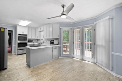 Kitchen and dining area with bay windows