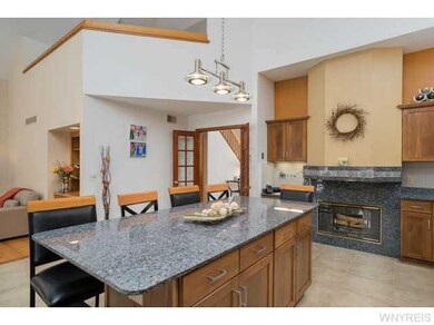 Kitchen. Double sided fireplace to great room.