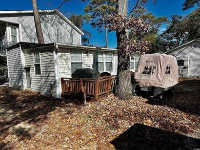 Rear view of house featuring a deck