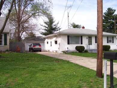 FRONT WEST SIDE OF HOME WITH GARAGE