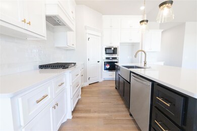 Kitchen with light wood-type flooring, light count