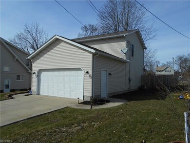 Side view of house showing wood fencing.