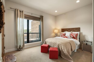 Carpeted bedroom featuring recessed lighting and 