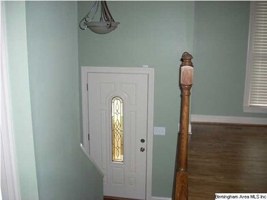 This home has a grand entrance with beautiful hard