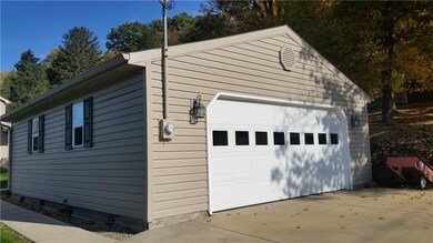 24x28 detached garage with paved drive.