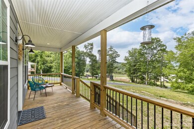 Covered front porch with winter mountain views