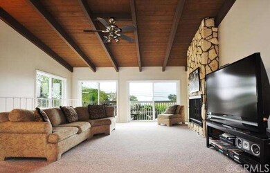 Living area adjacent to inviting balcony.  Partial