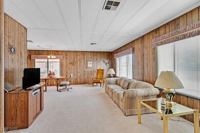 Living room with a wealth of natural light, wood w
