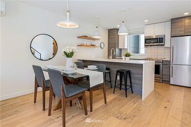 Dining room plus kitchen with bar seating. 