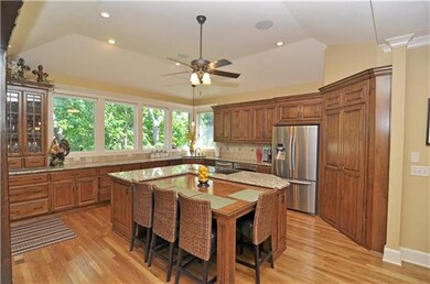 Uniquely designed center island with wood table th