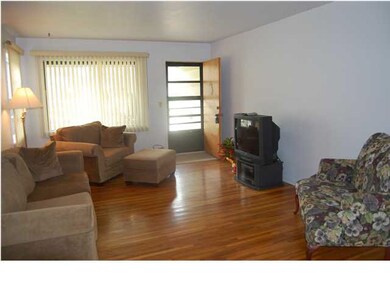Spacious Living Room with Beautiful Hard Wood Floo