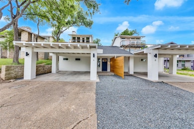 View of front of property featuring a carport and