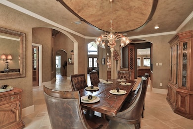 Formal Dining with exquisite ceiling detail and a wet bar