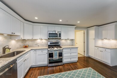 Featuring granite countertops, custom cabinets w/s