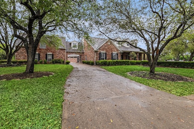 Driveway goes up through the porte-cochere to the