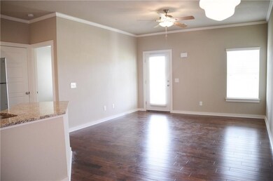 Living Room - Hardwood floors, crown molding and ceiling fan. Still time to pick colors *pictures are not of actual home but similar colors may vary