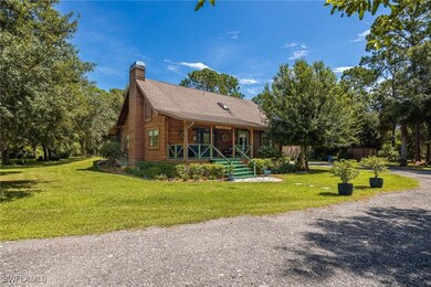 Log house with a beautiful front lawn and spacious
