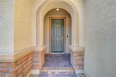 Entrance to property featuring stucco siding