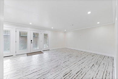Abundant natural light pours through the elegant F