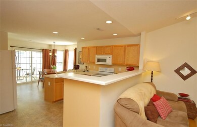 View from living room to kitchen and breakfast areas