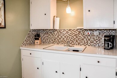 Glass tile backsplash in the kitchen.