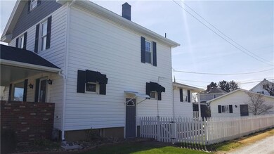 This home abuts an alley off St Clair allowing for