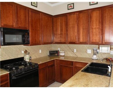 Kitchen. Beautiful cherry cabinets wth marble coun