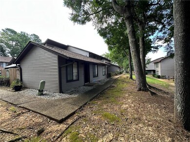 View of home's exterior with roof with shingles