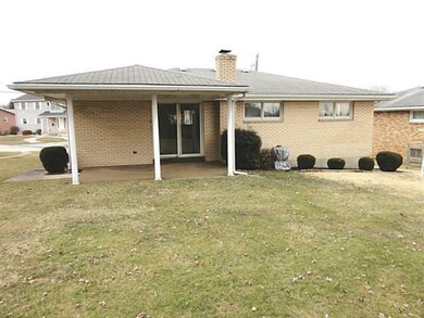 Exterior Back. Large level back yard with covered 