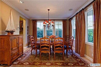 Formal dining room with custom drapery.