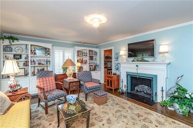 Living Room with Built Ins, Plantation Shutters, A