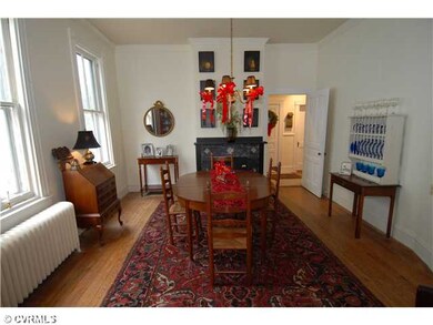 Dining Room - A great, large entertaining room with it's 10' ceilings, crown molding & beautiful hardwood floors.