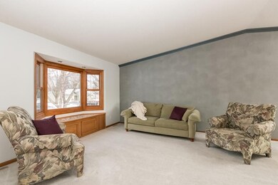 Large living room with beautiful bay window.
