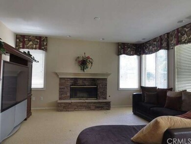 Large family room with lots of window and canned l