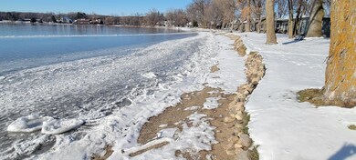 Level lot 107 feet of sandy beach