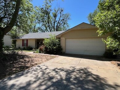 Ranch-style home with a garage