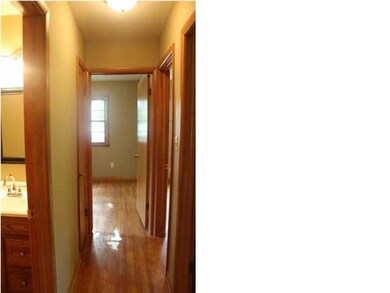 Hallway to the three bedrooms