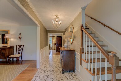 Foyer entrance featuring light hardwood / wood-sty
