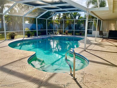 View of pool with a patio and a lanai